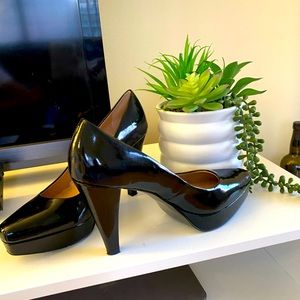 Tahari patent leather pumps.